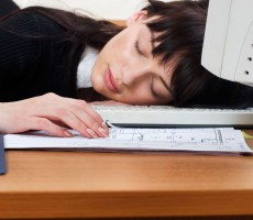 Woman asleep at computer