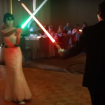 Power Couple Goes All In On Historic Light Saber Duel First Dance